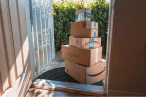 Amazon packages piled up at the front door