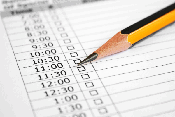 Pencil ready to mark meeting and time checklist