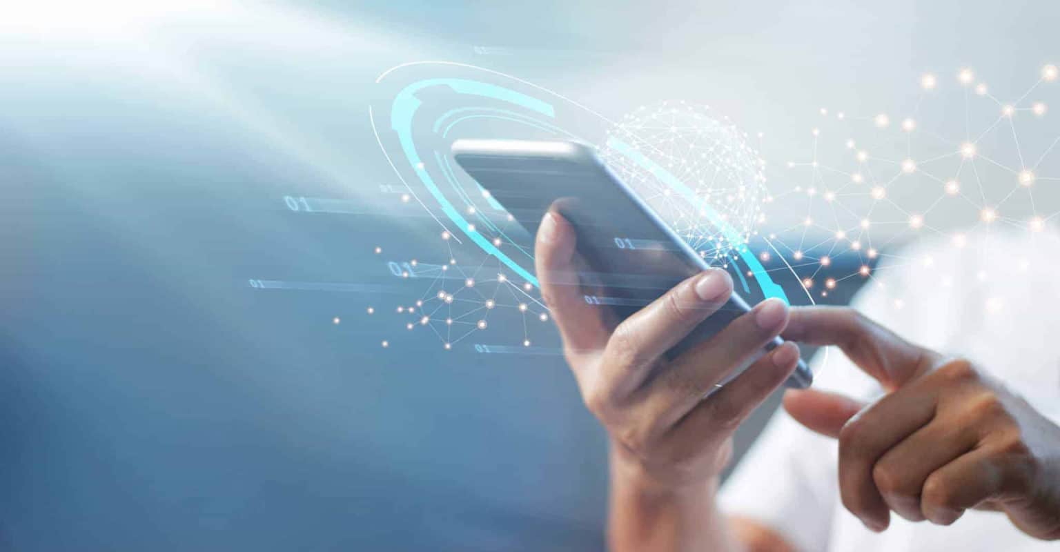 A person uses a smartphone with one hand while the other touches the screen. Digital network graphics and binary code are overlaid, symbolizing technology, connectivity, and Instacart Advertising in the digital marketplace.