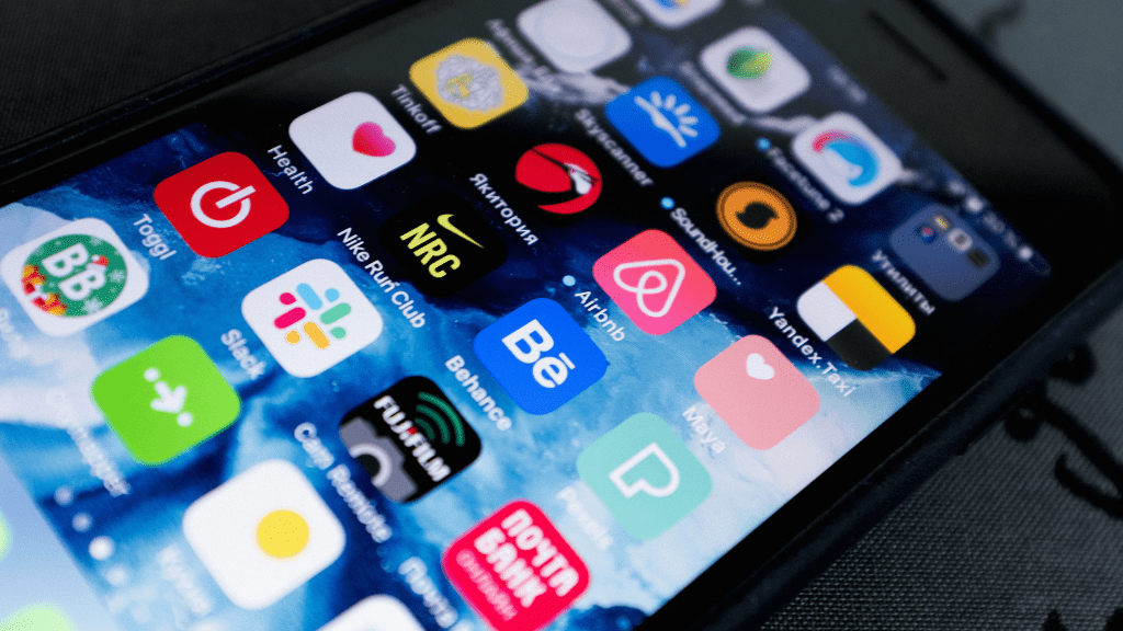 A smartphone loaded with different apps from the app store with companies using best mobile app marketing strategies.