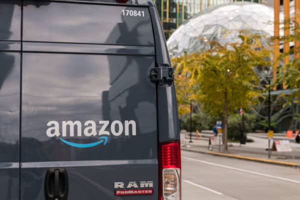 Late in the day an Amazon Prime delivery truck by the Amazon HQ.