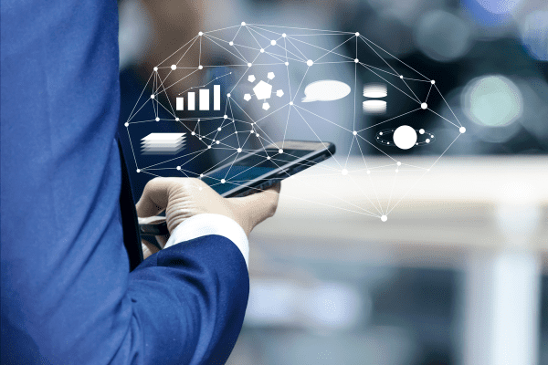Businessman on his smartphone that has the capability to gather app marketing metrics.