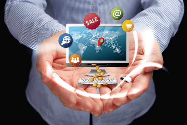 Man holding on to a computer with ecommerce advertising software capabilities