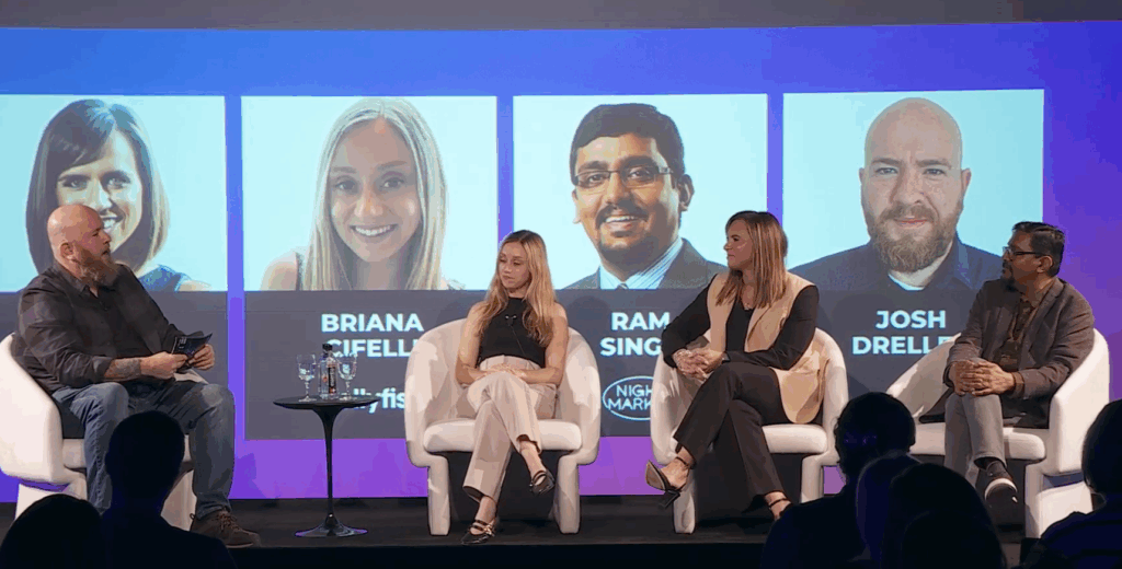 Four people sit on stage in white chairs having a panel discussion about ShopGPT. Behind them are large images and names of panelists: Briana Ciuffetelli, Ramneek Singh, Josh Drella, and another woman. The background is purple and blue.